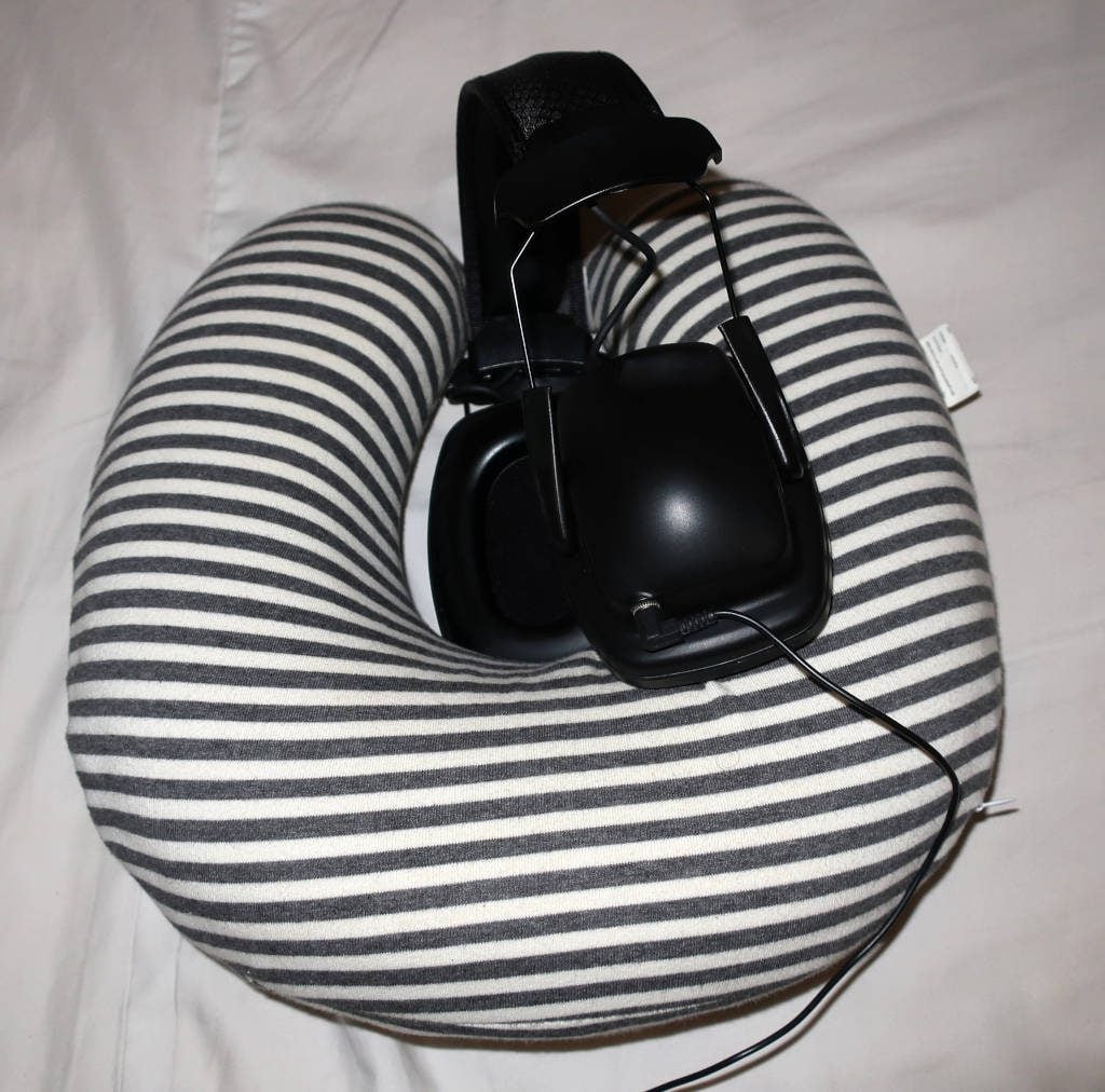 Sleeping with full-size headphones and earmuffs